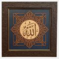 Central Arabic calligraphy: Allah Wooden medallion with geometric star & arabesque details Rich navy blue panel for elegance & depth Textured dark wooden frame with gold accent Ideal for home décor, prayer rooms, offices, and gifting Exclusive design by Floorwalle Decor Dubai